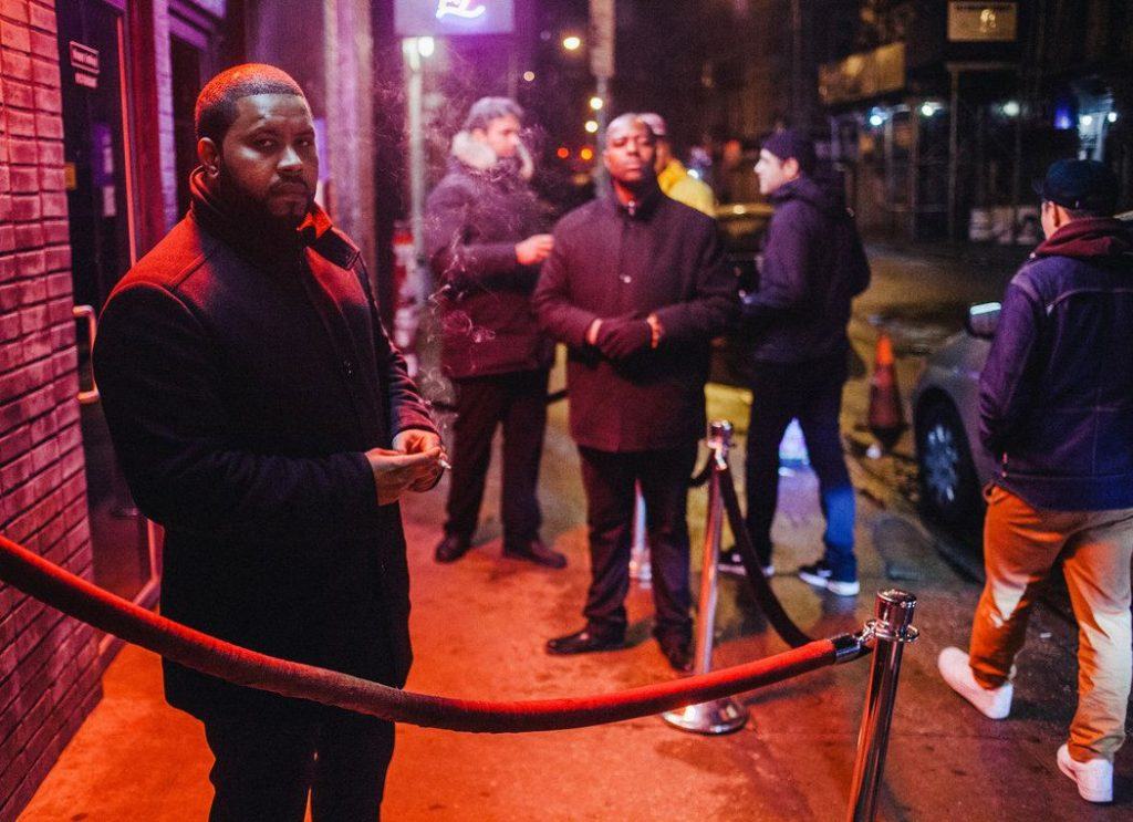 Security man working within the New York night life